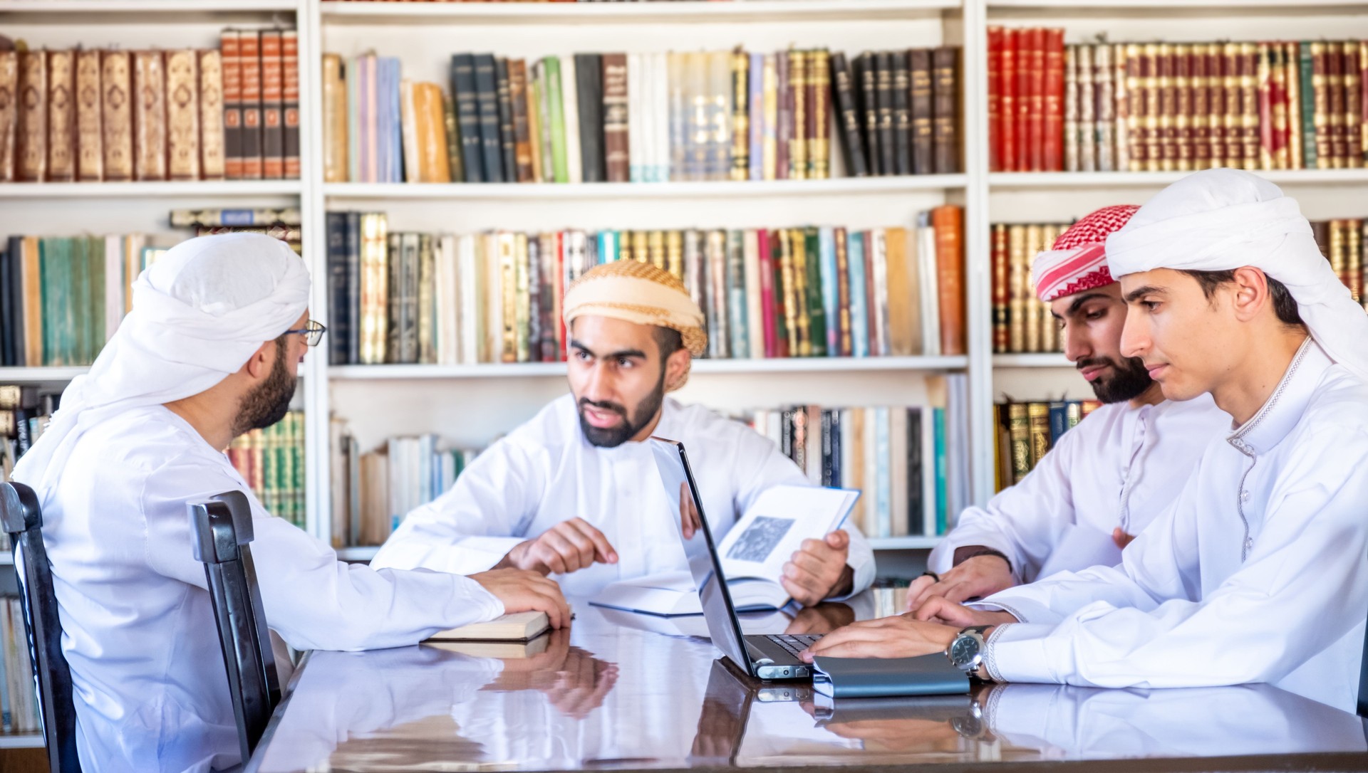 Middle Eastern Men Collaborating in Traditional Library Setting